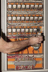 electrical engineer replacing a relay in an ebms control panel