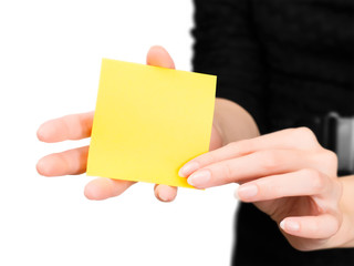 Woman hands with blurred silhouette holding memo stick isolated