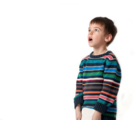 a 5 year old boy making a silly face,isolated on white background