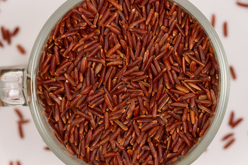 Wild red rice in a glass mug. Healthy food rich in vegetable protein and fiber. Nutritionists...