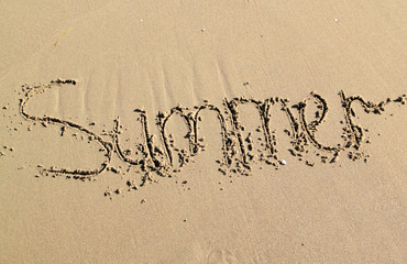 word summer written in the sand
