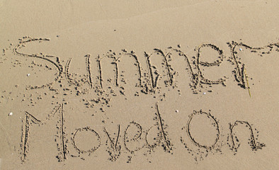 summer moved on written in the sand of seashore