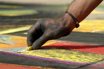 Madonnari- Street art with chalk, woman hand woman hand
