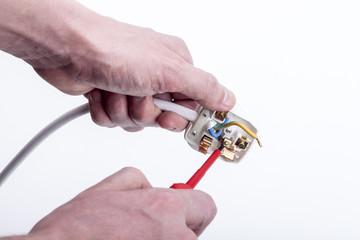 engineer wiring a uk mains plug