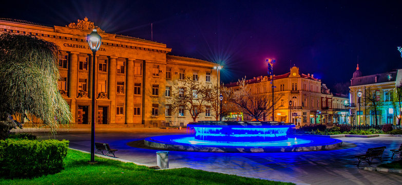 night view of the illuminated building of justice in bulgarian city rousse - ruse.