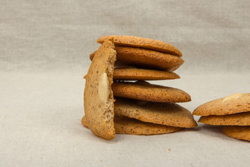 Half of almond cookie front view close-up