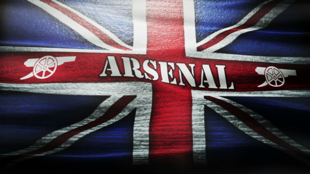 Waving Arsenal F.C. flag.