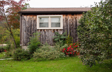 Wooden house surrounded by grass