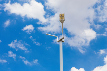 Street light with halogen lamp against blue sky