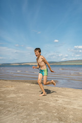 Boy running on the beach