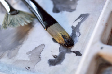 Closeup of two paintbrushes