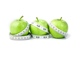 green apple with Measuring tape in diet concept 