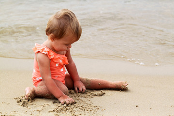 close up view of baby on a sand beach