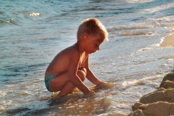 Kid playing on the beach