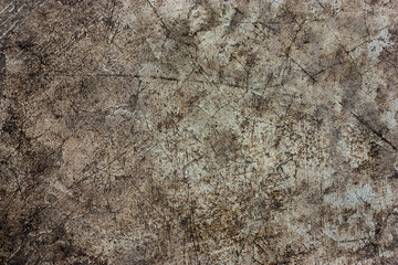 Cement floors are old and dirty.