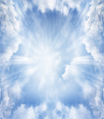 Bright rays of light in blue sky