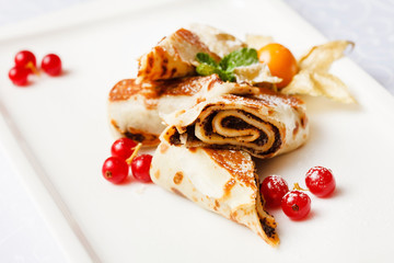 pancakes with chocolate and berries