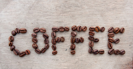 Coffee written with roasted coffee beans