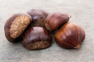 Fine chestnuts. All on wooden background