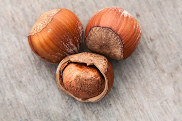 Fine hazelnuts. All on wooden background