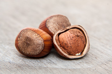 Fine hazelnuts. All on wooden background
