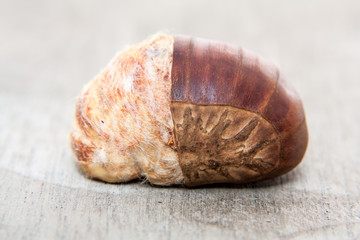 Fine chestnuts. All on wooden background