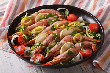 king shrimps with chilli, herbs and vegetables close-up. horizontal
