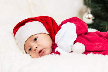 cute baby sleeping in Christmas clothes