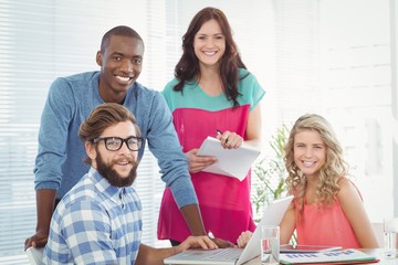 Obraz premium Portrait of smiling business people at desk