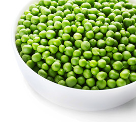 Fresh green peas in bowl isolated on white