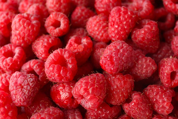 Heap of sweet red raspberries close up