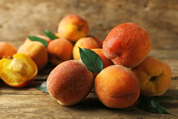 Fototapeta na wymiar Ripe peaches on wooden background