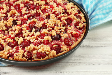 Tasty homemade pie with cherries on table close up
