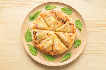 Rustic pizza on wooden background. Top view