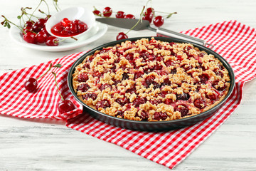 Tasty homemade pie with cherries on table close up