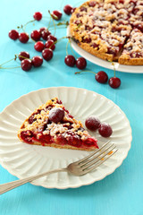 Tasty homemade pie with cherries on table close up