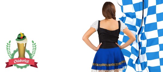 Composite image of oktoberfest girl standing with hands on hips