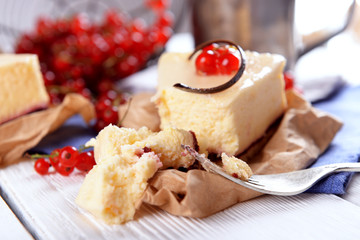 Tasty cheesecake with berries on table close up