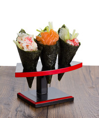 Sushi temaki over wooden vintage background