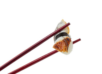 Sushi nigiri in brown chopsticks isolated on white background