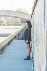 Beautiful girl posing in an urban context