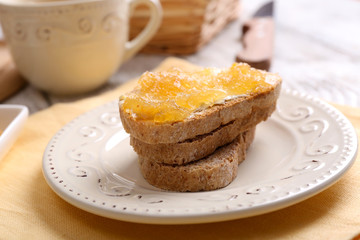Fresh toast with butter and jam on table close up © Africa Studio