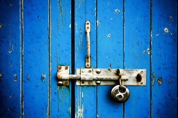 Blue wooden door with padlock