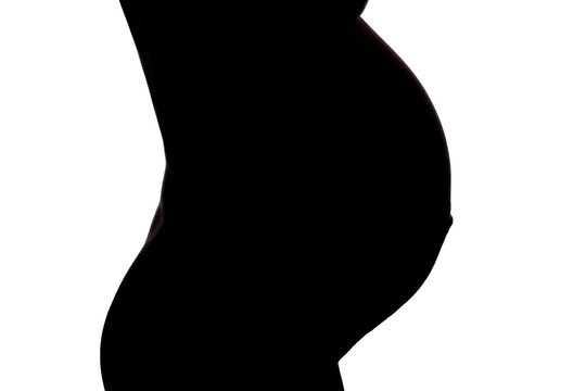 Silhouette vom Bauch einer schwangeren Frau
