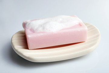 Soap with foam isolated on white