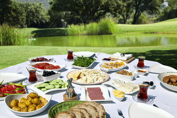 Rich and delicious Turkish breakfast on rounded table