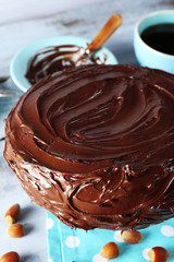 chocolate cake with hazelnuts and coffee on table