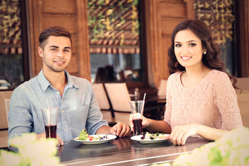 beautiful young couple have dating in cafe