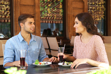 beautiful young couple have dating in cafe