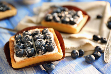 Fototapeta na wymiar Still life with gourmet fresh blueberry tarts